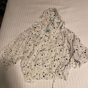 karlie white top with black stars and hood